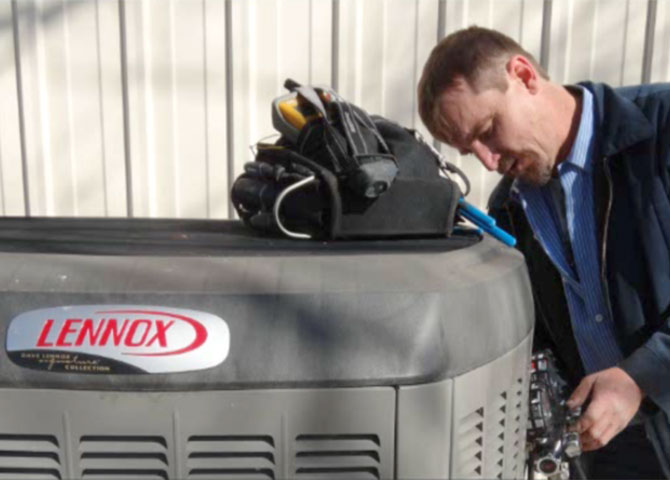 Dave working on an air conditioner