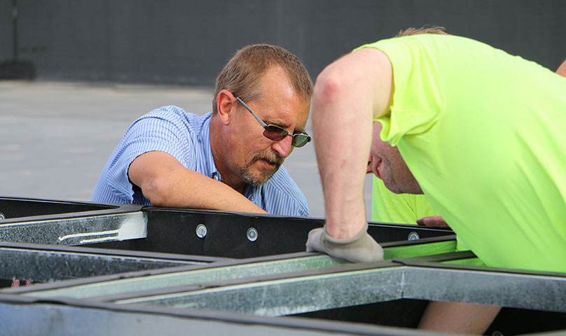 Men working on a commercial unit